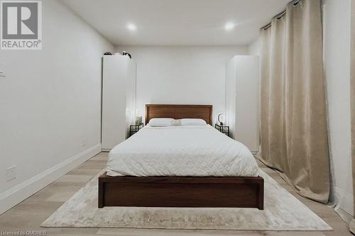 Bedroom with light wood-type flooring - 1701 Lampman Avenue Unit# 601, Burlington, ON - Indoor Photo Showing Bedroom