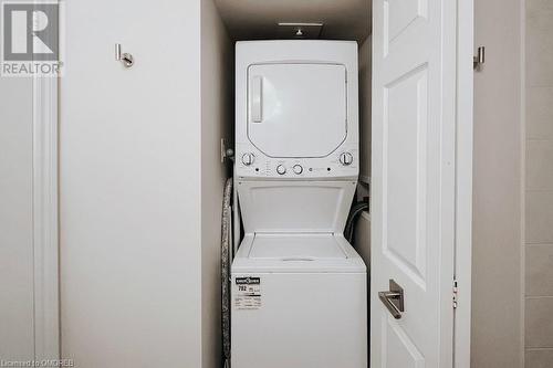 Laundry room featuring stacked washer / dryer - 1701 Lampman Avenue Unit# 601, Burlington, ON - Indoor Photo Showing Laundry Room