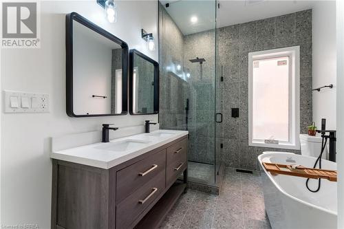 Bathroom with vanity, plus walk in shower, and tile walls - 50 Ontario Street, Brantford, ON - Indoor Photo Showing Bathroom