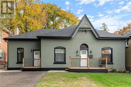 View of front of house featuring a front yard - 50 Ontario Street, Brantford, ON - Outdoor With Deck Patio Veranda