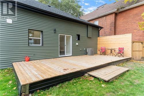 Wooden terrace featuring central air condition unit and a yard - 50 Ontario Street, Brantford, ON - Outdoor With Deck Patio Veranda With Exterior