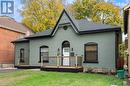 View of front of property featuring a wooden deck and a front lawn - 50 Ontario Street, Brantford, ON  - Outdoor With Deck Patio Veranda 