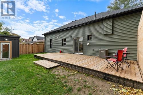 Rear view of property with central AC, a yard, and a deck - 50 Ontario Street, Brantford, ON - Outdoor With Deck Patio Veranda With Exterior