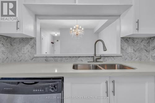 922 - 95 Trailwood Drive, Mississauga, ON - Indoor Photo Showing Kitchen With Double Sink