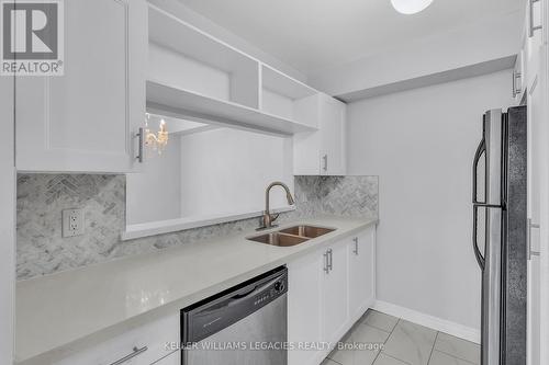 922 - 95 Trailwood Drive, Mississauga, ON - Indoor Photo Showing Kitchen With Double Sink