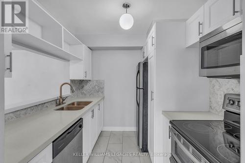 922 - 95 Trailwood Drive, Mississauga, ON - Indoor Photo Showing Kitchen With Double Sink