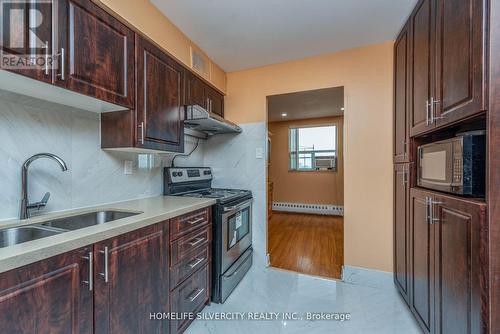 605 - 3555 Derry Road E, Mississauga, ON - Indoor Photo Showing Kitchen With Double Sink