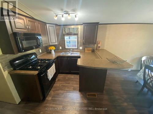 103 - 1082 Shamrock Marina Road, Gravenhurst, ON - Indoor Photo Showing Kitchen With Double Sink