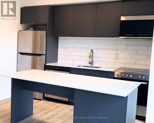 210 - 325 University Avenue W, Cobourg, ON - Indoor Photo Showing Kitchen With Stainless Steel Kitchen With Upgraded Kitchen