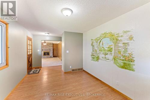 1033 Coupland Road, South Frontenac (Frontenac South), ON - Indoor Photo Showing Other Room With Fireplace