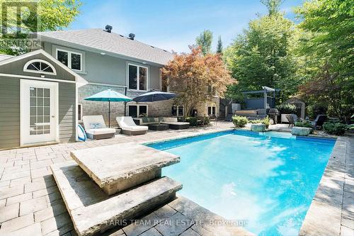 2 Reillys Run, Springwater, ON - Outdoor With In Ground Pool With Deck Patio Veranda