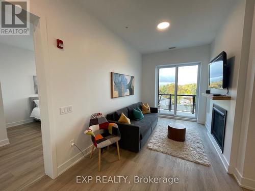 Ph2 - 19 West Street N, Kawartha Lakes, ON - Indoor Photo Showing Living Room With Fireplace