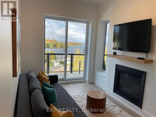 Ph2 - 19 West Street N, Kawartha Lakes, ON - Indoor Photo Showing Living Room With Fireplace