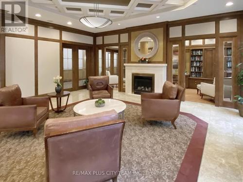 224 - 80 Harrison Garden Boulevard, Toronto, ON - Indoor Photo Showing Living Room With Fireplace