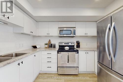 63 - 2441 Greenwich Drive, Oakville, ON - Indoor Photo Showing Kitchen With Stainless Steel Kitchen With Double Sink