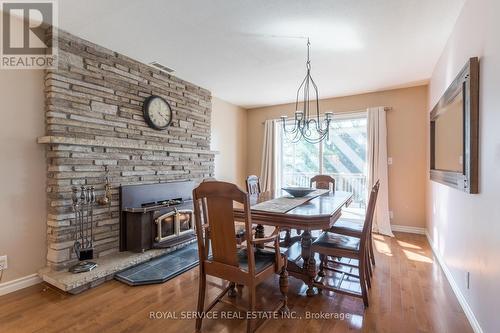 613 Christopher Road, Peterborough (Ashburnham), ON - Indoor Photo Showing Dining Room With Fireplace