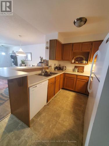 B 104 - 182 D'Arcy Street, Cobourg, ON - Indoor Photo Showing Kitchen With Double Sink