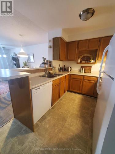 B 104 - 182 D'Arcy Street, Cobourg, ON - Indoor Photo Showing Kitchen With Double Sink