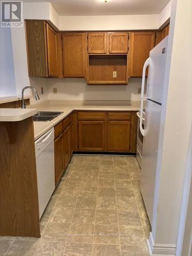 B 104 - 182 D'Arcy Street, Cobourg, ON - Indoor Photo Showing Kitchen With Double Sink