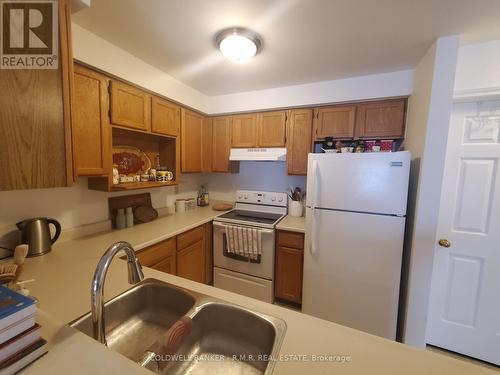 B 104 - 182 D'Arcy Street, Cobourg, ON - Indoor Photo Showing Kitchen With Double Sink