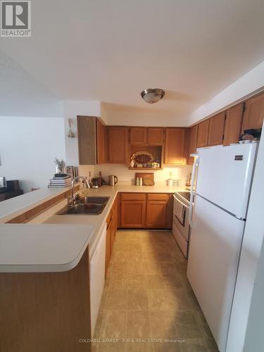 B 104 - 182 D'Arcy Street, Cobourg, ON - Indoor Photo Showing Kitchen With Double Sink