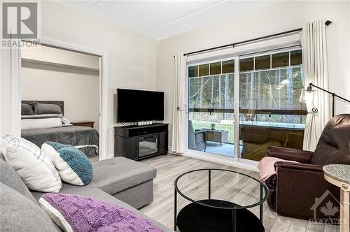 91 St Moritz Trail Unit#305, Embrun, ON - Indoor Photo Showing Living Room With Fireplace