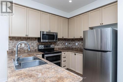 311 Andrews Trail, Milton, ON - Indoor Photo Showing Kitchen With Double Sink