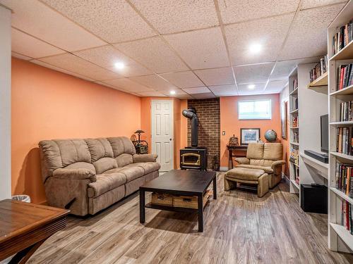 Family room - 51 2E Rue Pin, Sainte-Marcelline-De-Kildare, QC - Indoor Photo Showing Basement With Fireplace