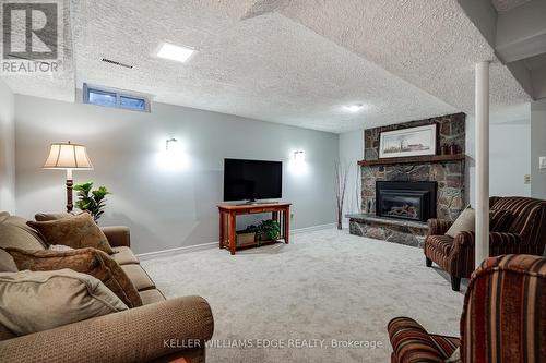 106 - 2301 Cavendish Drive, Burlington, ON - Indoor Photo Showing Living Room With Fireplace