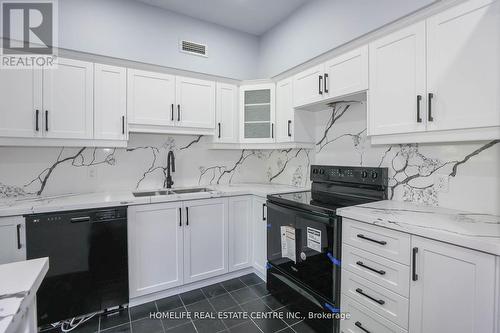 117 - 8111 Forest Glen Drive, Niagara Falls, ON - Indoor Photo Showing Kitchen With Double Sink