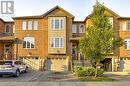 View of property featuring a garage - 151 Green Road S Unit# 26, Stoney Creek, ON  - Outdoor With Facade 