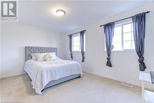 Carpeted bedroom with a textured ceiling - 151 Green Road S Unit# 26, Stoney Creek, ON - Indoor Photo Showing Bedroom