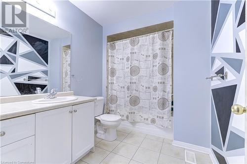 Full bathroom with toilet, vanity, tile patterned floors, and shower / tub combo - 151 Green Road S Unit# 26, Stoney Creek, ON - Indoor Photo Showing Bathroom