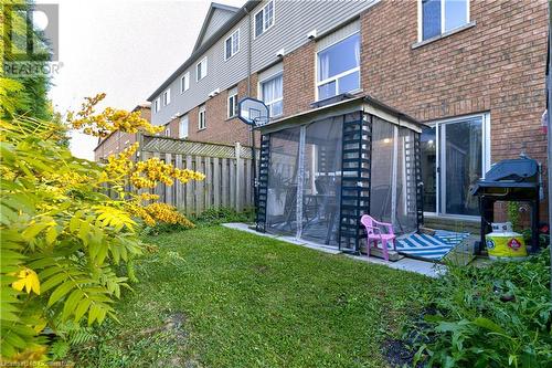 View of yard with a sunroom - 151 Green Road S Unit# 26, Stoney Creek, ON - Outdoor