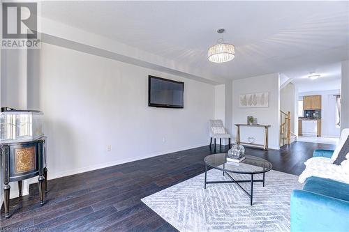 Living room featuring dark wood-type flooring - 151 Green Road S Unit# 26, Stoney Creek, ON - Indoor Photo Showing Living Room