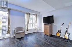 Sitting room featuring dark hardwood / wood-style floors - 