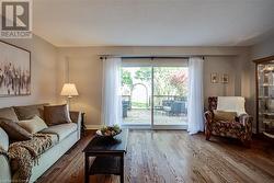 Living room,  hardwood flooring, sliding doors to private deck - 