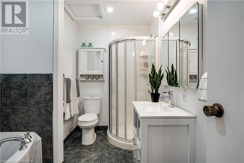 Full bathroom featuring toilet, vanity. Separate shower and tub - 2301 Cavendish Drive Unit# 106, Burlington, ON - Indoor Photo Showing Bathroom