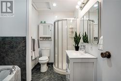 Full bathroom featuring toilet, vanity. Separate shower and tub - 