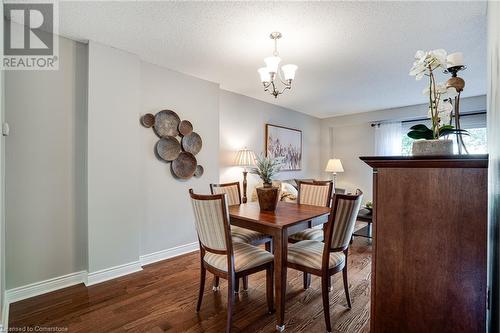 Dining area with  hardwood floors - 2301 Cavendish Drive Unit# 106, Burlington, ON - Indoor Photo Showing Dining Room