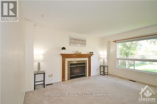 11 Tanner Crescent, Ottawa, ON - Indoor Photo Showing Living Room With Fireplace