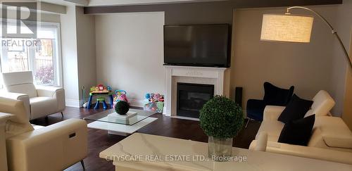 64 Burlwood Road, Brampton, ON - Indoor Photo Showing Living Room With Fireplace