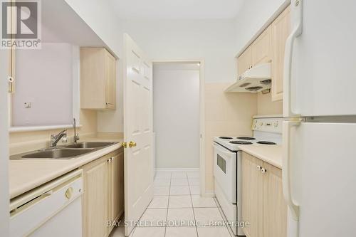 107 - 5039 Finch Avenue E, Toronto, ON - Indoor Photo Showing Kitchen With Double Sink