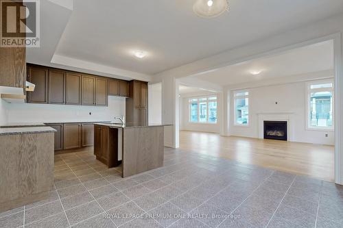 9 Ann Mckee Street, Caledon, ON - Indoor Photo Showing Kitchen With Fireplace