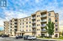 307 - 325 Village Grove, Tecumseh, ON  - Outdoor With Balcony With Facade 