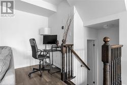 Home office featuring dark hardwood / wood-style flooring - 