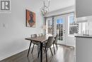 Dining area featuring dark wood-type flooring and a notable chandelier - 143 Ridge Road Unit# 68, Cambridge, ON  - Indoor Photo Showing Dining Room 