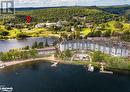 This condo is in the building closest to The  Pavilion with Recreation Centre, Restaurants, and Entertainment Centre - 1235 Deerhurst Drive Unit# 51-208, Huntsville, ON  - Outdoor With Body Of Water With View 