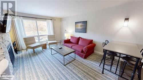 Living room with fireplace - 1235 Deerhurst Drive Unit# 51-208, Huntsville, ON - Indoor Photo Showing Living Room