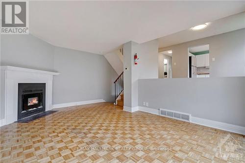 12F Larkshire Lane, Ottawa, ON - Indoor With Fireplace